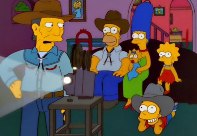 Cowboy Buck McCoy zeigt den Simpsons einen Film.